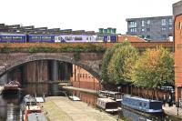 A Northern Rail class 150 passes over Castlefield Basin, Manchester, in September 2009.<br><br>[Ian Dinmore 28/09/2009]