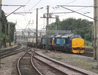 Immaculate DRS EE Type 3 37425 <I>Concrete Bob</I> hauls DRS 57004 and four flasks through Preston on a Crewe to Sellafield train on 22nd August 2013. <br><br>[Mark Bartlett 22/08/2013]