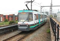 Only a few 1st generation trams remained in service on Metrolink in the summer of 2013 and just down the line from Cornbrook, at Trafford Depot, there were long lines of tramcars awaiting disposal. The original Cornbrook station was on the adjacent Altrincham line and closed in 1965 whereas the Metrolink line uses the old CLC/Midland line from Manchester Central. 1009 heads for the city centre.  <br><br>[Mark Bartlett 31/07/2013]