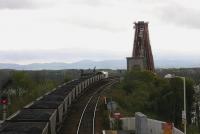 An up coal train climbs towards the Forth Bridge from North Queensferry late in the afternoon of 3 April 2005. View from the station footbridge, with the Pentland Hills forming the horizon some 15 miles to the south.<br><br>[John Furnevel 03/04/2005]