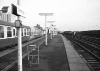 Looking north through Cambridge station on 18 January 1976. One through platform with bays at either end, how times have changed; goodbye steam heat Mark 1 coaches and the freight sidings on the right; hello to 25KV and Networker EMUs. The platform trolley looks a little lost.<br><br>[John McIntyre 18/01/1976]