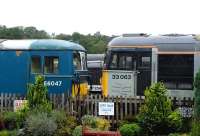 The front ends of three Spa Valley Railway ex-BR <I>post-modernisation</I> locomotives in the sidings at Tunbridge Wells West on 14 September 2013. On the left is EE electro-diesel E6047 (73140) of 1966, on the right BRCW Type 3 no 33063 (D6583) of 1962, with EE Type 3 no 37254 (D6954) of 1965 just visible through the gap.<br><br>[Peter Todd 14/09/2013]