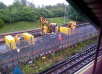 It's not every day that you see a PW gang at work on the tube; especially in daylight. These chaps at work alongside High Barnet station in July 2013 seem to be fettling the  carriage sidings. Notice the unusually 'green' background.<br><br>[Ken Strachan 30/07/2013]