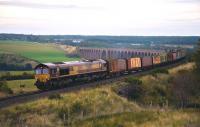 66103 leaves Culloden Viaduct on its way south with a train of withdrawn timber wagonson 28 September. The wagons were being taken to Doncaster for scrapping.<br><br>[John Gray 28/09/2013]