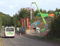 Saturday morning construction work on the new Gore Glen bridge, seen here looking north on 5 October 2013. The structure will carry the Borders Railway across the A7 between Newtongrange and Gorebridge.<br><br>[John Furnevel 05/10/2013]