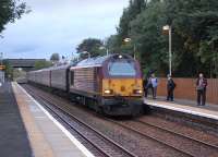 67011 brings the 07.36 Cardenden - Edinburgh commuter train into Rosyth on 7 October. That <I>Metro</I> must be interesting!<br><br>[Bill Roberton 07/10/2013]