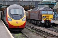 <I>The Statesman</I> Rail charter from Cambridge to Fort William at Carlisle on 11 October behind West Coast 57314 stands alongside a Virgin Pendolino on a Glasgow Central - London Euston service.<br><br>[Bill Roberton 11/10/2013]