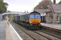 DRS 66303 passes through a wet Pitlochry station on 9 October with the 4D47 Inverness - Mossend intermodal.<br>
<br><br>[Bill Roberton 09/10/2013]