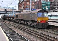 Vying for the award of filthiest main line diesel seen by the photographer are 66424 and 66430 at Carlisle on 11 October on WCML RHTT duty.<br><br>[Bill Roberton 11/10/2013]