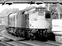 A pair of Type 2s running south through Dumfries in June 1972 with a lengthy parcels train. Leading locomotive is 5378.<br><br>[John Furnevel 03/06/1972]