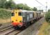 DRS 20308 and 20303, taking two nuclear flasks from Crewe to Sellafield with a load for reprocessing, seen on the WCML just north of Barton and Broughton station on 21 August. The guard is presumably enjoying the forward view from the driver's seat of 20303.<br><br>[Mark Bartlett 21/08/2013]