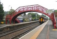 ScotRail 156465 passes through Riding Mill station on a Newcastle bound service that started at Glasgow Central and travelled via the G&SW route.<br><br>[Mark Bartlett 04/10/2013]