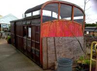 A bird cage and a dog box: the former being the glassy upper section allowing the guard to see over the train, the latter being quite literally a place to store pasengers' dogs (the hinged doors can be seen below the cage). 1912 North London Railway grounded coach body.<br><br>[Ken Strachan 20/07/2013]