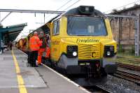 <I>'So it's straight on at the lights...'</I> Crew change for Freightliner 70006, hauling a Colas crane north through Carlisle station on 11 October 2013. <br><br>[Bill Roberton 11/10/2013]