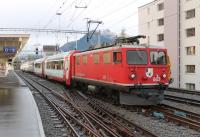 Built in 1947, and still in front line service, RhB Ge4/4 1 No. 603 <I>Badus</I> stands at Davos Platz waiting to move the westbound <I>Glacier Express</I> stock into the platform from its overnight stabling road before taking it out to Chur. The class of ten was modernised in 1986, and six have been scrapped in recent years, but its a testament to the survivors that they are still entrusted with a prestige service like this. Note the old style dining car in the rake of <I>Panoramique</I> stock [See image 45044]<br><br>[Mark Bartlett 18/09/2013]
