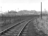 Looking along the closed Riddochhill Colliery/British Leyland branch in 1984 with Bathgate Upper station in the background.<br><br>[Bill Roberton //1984]