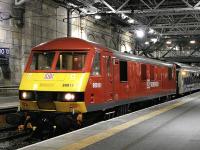 DB-liveried 90018 with the London sleeper at Waverley on the evening of 24 October. <br><br>[Bill Roberton 24/10/2013]