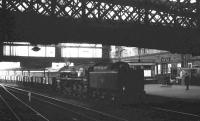 BR Standard class 9F 2-10-0 no 92021 brings a southbound ballast train through Carlisle station in August 1965. The locomotive was one of 10 examples of the class (92020 - 92029) originally built with Franco-Crosti boilers, prior to later conversion to the standard arrangement. <br><br>[K A Gray 22/08/1965]