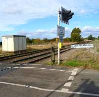 There is notrace of the former station at Claxby & Usselby (closed in March 1960) which was located on the far side of the crossing on Park Road. View looking north on 9 October 2013.<br><br>[John McIntyre 09/10/2013]