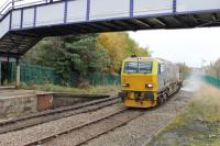 <I>Stand well back!</I> An MPV on leaf clearance duties slowly negotiates the sharp curve into Accrington station on 15 November with the water jets in full flow.<br><br>[Mark Bartlett 15/11/2013]