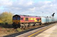 66194 creeps into the sidings at Didcot on 22 November with a lengthy freight.<br><br>[Peter Todd 22/11/2013]