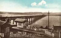 Wormit station at the south end of the Tay Bridge. This was the first station on the Newport Railway running east from here to Tayport. This postcard view shows the second bridge.<br><br>[Ewan Crawford Collection //]