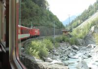 Climbing one of the Zermatt branch rack sections, where speed is limited to 25mph, is MGB No.4 <I>Taschhorn</I> on a train from Brig. The HGe 4/4 II 2590hp electric, dating from 1990, is one of a class of 21 that handle most MGB loco hauled services. <br><br>[Mark Bartlett 11/09/2013]