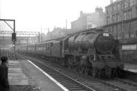Royal Scot 46132 <I>The King's Regiment Liverpool</I> runs through Eglinton Street shortly after leaving Glasgow Central on 14 July 1962 with the 10.55am service to Manchester. A DMU can be seen crossing the bridge carrying the CGU line to St Enoch in the background.<br><br>[John Robin 14/07/1962]