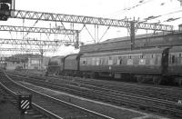 Duchess Pacific no 46243 <I>City of Lancaster</I> pulls out of Glasgow Central on 23 June 1962 with the 9.55am relief service to London Euston. This Saturday working utilised the stock off <I>The Caledonian</I> weekday service.<br><br>[John Robin 23/06/1962]