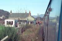 The closed station at Dalguise viewed from a northbound train on 8 February 1989. The train had just been flagged to safely cross the Dalguise Viaduct by the linesmen seen to the side of the locomotive. This was the day of the Ness Viaduct collapse.<br><br>[Ewan Crawford 08/02/1989]