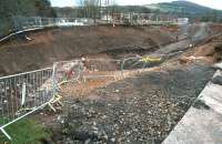 View west over a section of Winston Road, Galashiels, on 10 December 2013 with excavation of the old infilled railway bridge almost complete [see image 42351]. <br><br>[John Furnevel 10/12/2013]