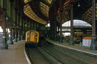 The 1840 station at Brighton, as it appeared on 8th October 1977, with some modernization work in progress. A four car Class 421 unit (No 7306) is about to depart.<br><br>[Mark Dufton 08/10/1977]