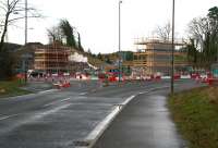 Approaching Hardengreen roundabout from Eskbank on 15 December, with work on the supports for the new bridge that will carry the Borders Railway well advanced.<br><br>[John Furnevel /12/2013]
