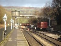 The north end of Grosmont NYMR Station on 15 December, showing the refurbished former Scarborough Falsgrave signal gantry framing the storage sidings. Maintenance work is in progress at the four way points on the connection to Network Rail beyond the platform end. <br><br>[David Pesterfield 15/12/2013]