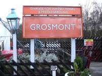 The station name board on the NYMR Grosmont Station main platform showing the route options available (winter Sunday excepted) from the Northern Rail Esk Valley line platform sited on the opposite side of the station car park. The initials of the photographer are also indicated below the board!<br><br>[David Pesterfield 15/12/2013]