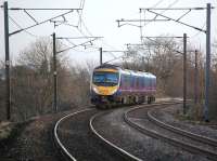 First Transpennine 185127 with the 07.25 service from Manchester Airport to Edinburgh, a little to the east of Curriehill on 17 December.  Soon to be replaced by a class 350 electric unit...<br><br>[Bill Roberton 17/12/2013]