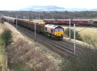 A northbound freight passing Ravenstruther in December 2005 behind EWS 66081. The locomotive has just passed the tail end of a train about to run through the coal loading terminal with 66212 at the other end [see image 5590].<br><br>[John Furnevel 19/12/2005]