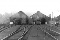 A visit to Dumfries on 26 August 1960. View north over the shed yard with the G&SW main line running past on the left. Locomotives on shed that day included Black 5s, 2P 4-4-0s and ex-Caledonian 0-6-0s. Dumfries shed finally closed in May 1966. [See image 3570] <br><br>[David Stewart 26/08/1960]