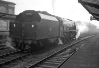 Upperby shed's 46250 <I>City of Lichfield</I> waits expectantly on the centre road at Carlisle on Leap Day 1964. The Pacific is awaiting the arrival of the 9am ex-Perth, which it will take south. [See image 34634]<br><br>[K A Gray 29/02/1964]