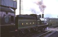 Ex-Great North of Scotland Railway 4-4-0 No 49 <I>Gordon Highlander</I> in the process of taking on water at Auchengray on 19 April 1965 with <I>Scottish Rambler No 4</I>. The special was on its way from Leith Central to Carstairs. <br><br>[G W Robin 19/04/1965]