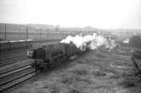 Stanier Pacific no 46228 <I>Duchess of Rutland</I> passes Carlisle Upperby with a down parcels train on a wet Wednesday in June 1964.<br><br>[John Robin 17/06/1964]