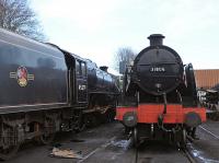 Stanier Black 5 45379 stands alongside Maunsell 'U' Class 2-6-0 31806 in Ropley shed yard on 28 December 2013.<br><br>[Peter Todd 28/12/2013]