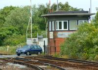 The impressive signalbox next to Albert Road level crossing at the north end of Deal station in Kent. Photographed from the platform on 2 July 2012 looking towards Sandwich. The signalbox is a notable example of Southern Railway 1930s Odeon/Art Deco <I>glasshouse</I> design.<br><br>[John McIntyre 02/07/2012]