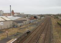From the Wigton station footbridge the <I>Innovia</I> cellophane factory complex can be seen. This featured in a <I>Michael Portillo</I> railway journey along the Cumbrian Coast although the internal sidings no longer receive rail traffic. View towards Maryport in February 2013<br><br>[Mark Bartlett 03/02/2013]