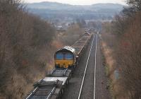 Looking north to Kingskettle from Forthar on 5 January, with 66103, 66069 and 66206 each on a train of reclaimed track and ballast from Ladybank.<br><br>[Bill Roberton 05/01/2013]