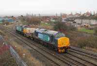 A more unusual combination on the Heysham flask train draws to a halt at Morecambe prior to reversing onto the branch. ETH fitted 37402 leads a single flask wagon with 57008 bringing up the rear.<br><br>[Mark Bartlett 14/01/2014]