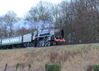 BR 9F 92212 with a train on the Mid Hants Railway near Ropley on 28 December 2013.<br><br>[Peter Todd 28/12/2013]