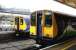 A pair of Silverlink class 313 dual voltage electric units standing side by side in the rain at Richmond's North London Line platforms 3 and 4 in July 2005. Platforms 5-7 beyond are used by District Line trains. This was the period when NLL services were running through to North Woolwich. [see image 5174]<br><br>[John Furnevel 22/07/2005]