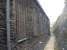 A view east down the 'cliff' side of the former 89C Machynlleth steam shed showing the many thousands of small random pieces of local stone used in the construction of the shed by the Cambrian Railway. <br><br>[David Pesterfield 17/10/2013]