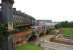 View south west with the viaduct that once carried lines out of Manchester Central station on the left as a Northern serviceheading into the citypasses below on the line from Ordsall Junction to Deansgate.<br><br>[John McIntyre 04/10/2013]